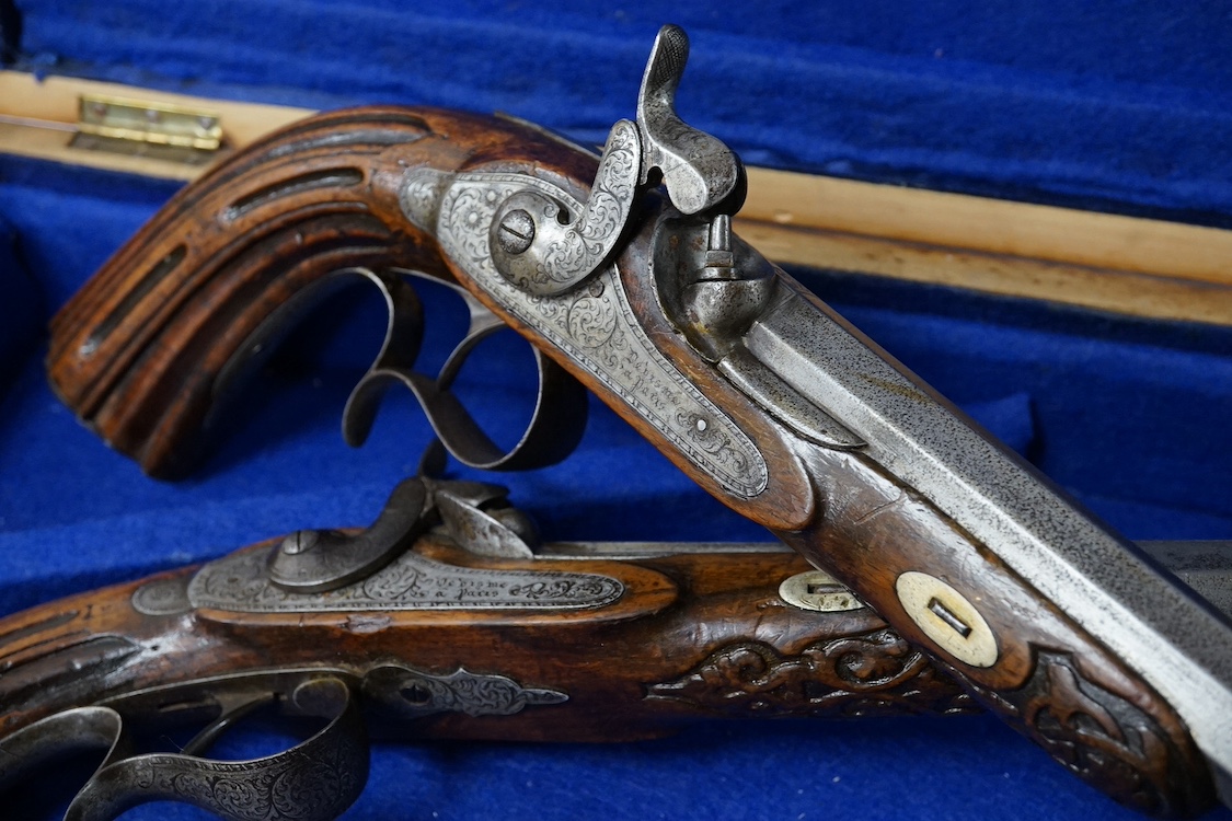 A pair of 40 bore percussion target pistols by Devisme of Paris, octagonal barrels cut with multi-groove rifling, engraved and signed locks, steel furniture ensuite, fluted walnut butts, half stocked, with gold inlaid nu